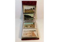 A vintage postcard album, mostly topographical of