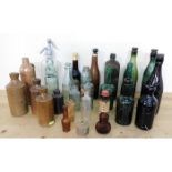 A quantity of vintage stoneware & glass bottles in