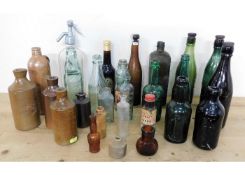 A quantity of vintage stoneware & glass bottles in