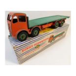 A boxed Dinky 902 diecast toy flat truck, some pla