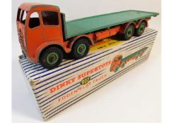 A boxed Dinky 902 diecast toy flat truck, some pla