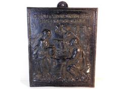 A 19thC. cast iron plaque of religious interest 14