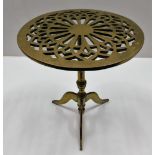 A heavy gauge brass trivet with pierced decor 12.6