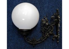 An ornate wall mounted light fitting with shade 19