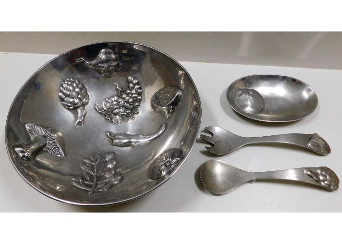 A large, over-sized alloy salad dish with accessor