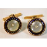 A pair of yellow metal enamel & pearl cuff links,