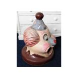 A large circus /theme park bin top in the form of an clown 33in high