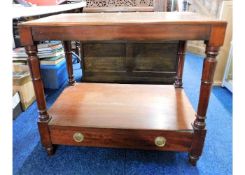 An Edwardian mahogany console table with drawer un