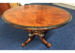 A Regency period oval tilt top dining table with b