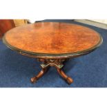 A Regency period oval tilt top dining table with b