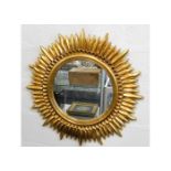 A decorative modern gilt framed mirror in art deco