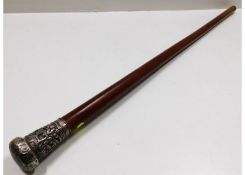 A white metal topped Malacca cane with embossed de