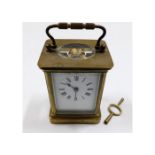 A brass carriage clock with key 5.5in tall inc. ha