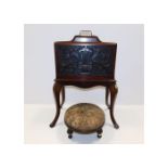 A c.1900 paper rack with carved decor, old repair,