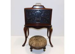 A c.1900 paper rack with carved decor, old repair,