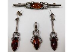 A three piece silver amber jewellery set