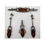 A three piece silver amber jewellery set