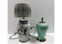 Two large, decorative modern table lamps, one with