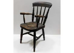 A 19thC. elm child's potty chair