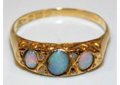 An 18ct gold ring set with opal & diamond a/f with