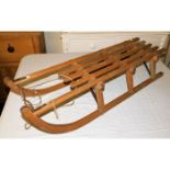 A Weber-Davos wooden sledge 43in long