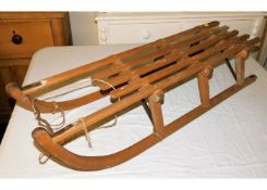 A Weber-Davos wooden sledge 43in long