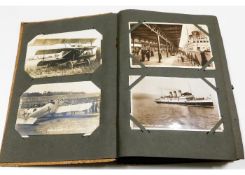 A vintage postcard album, mostly greetings cards a