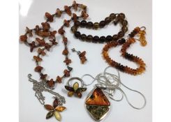 A quantity of amber jewellery including silver mou