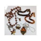 A quantity of amber jewellery including silver mou