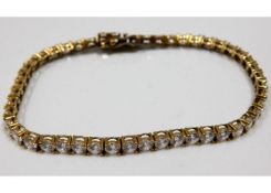 A 9ct gold line bracelet set with white stones 9.4g 7in long