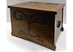 An oak art nouveau log box 20in wide x 14.5in deep