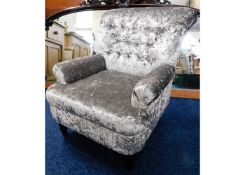 A small reupholstered button backed armchair with