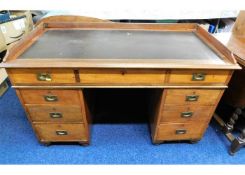 A military style pedestal desk with brass fittings