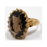 A 9ct gold ring set with smokey quartz 7.5g size P