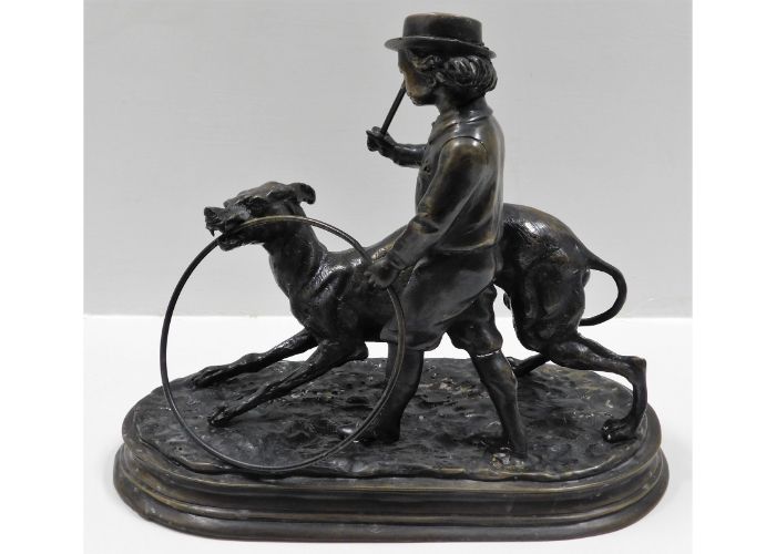 A bronze depicting a whippet with a boy & hoop aft