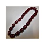 A set of cherry amber style beads 64.4g, 16in long