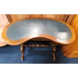 A Victorian kidney shaped walnut table with decora