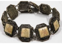 An Oriental white metal bracelet with bone inserts