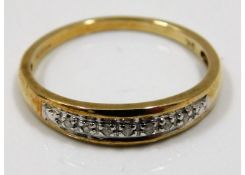 A 9ct gold ring set with small diamonds size Q/R 2