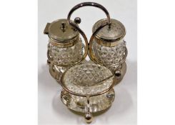 A small cut glass silver plate mounted cruet set