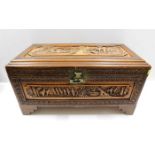 A carved Oriental camphor wood chest, fault to loc