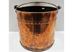 An antique rivetted copper fireside log bucket 12i