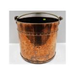 An antique rivetted copper fireside log bucket 12i