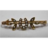 An 18ct gold bar brooch set with seed pearl 2.1g