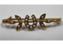 An 18ct gold bar brooch set with seed pearl 2.1g