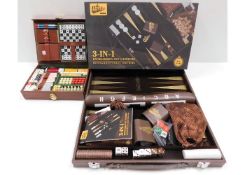 A boxed leather Backgammon & games set with a trav