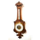 Late 19th/early 20th Century oak cased aneroid barometer having mercury thermometer with ceramic