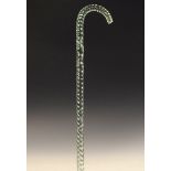 Green glass walking cane of rope twist design, 118cm high