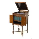 Lissenola oak-cased floor-standing wind-up gramophone cabinet with integral speaker