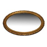 Early 20th Century oval wall mirror with bevelled plate in moulded rope-twist surround, 89cm high